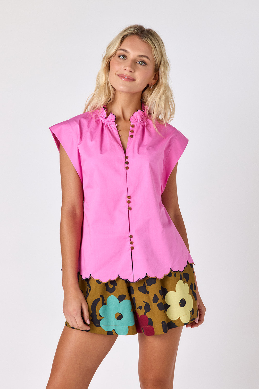 Happy Leopard shorts with Poppy Pink raglan top with scallop detail on model — CROSBY by Mollie Burch