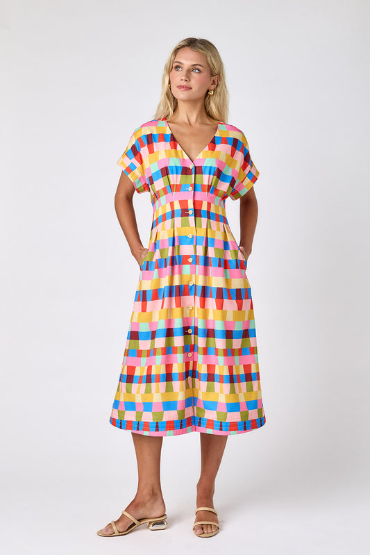 Prism short sleeved button-front midi dress with waist emphasis on model — CROSBY by Mollie Burch