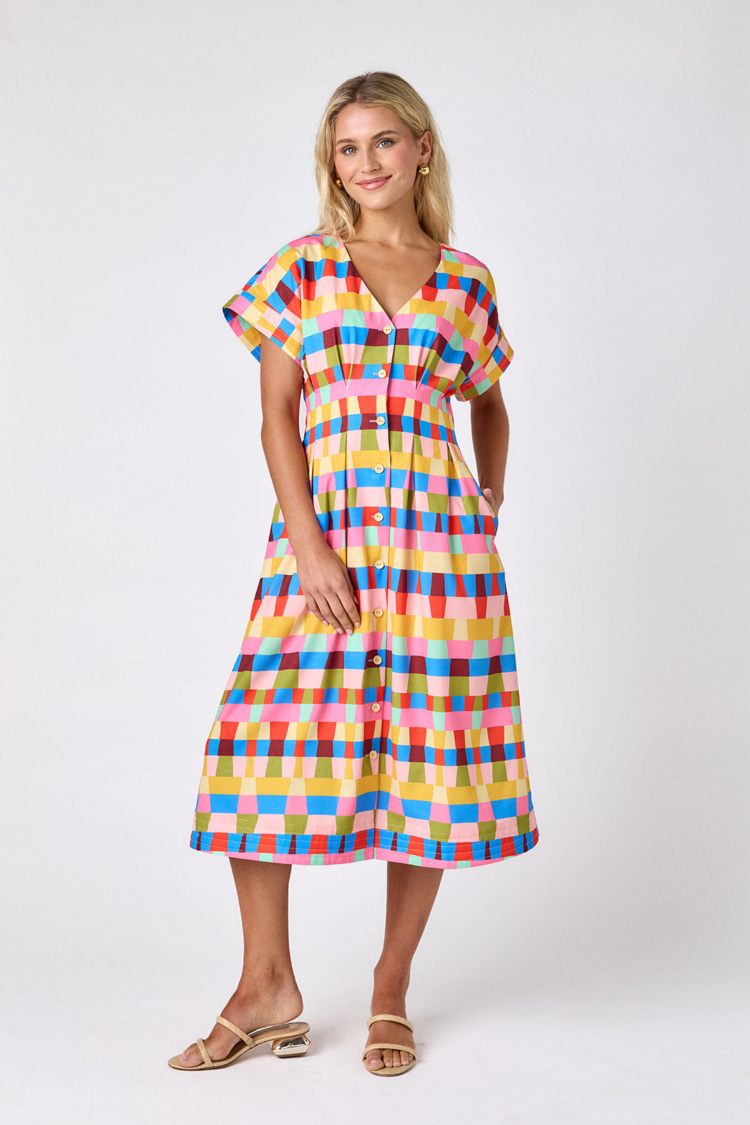 Prism short sleeved button-front midi dress with waist emphasis on model — CROSBY by Mollie Burch