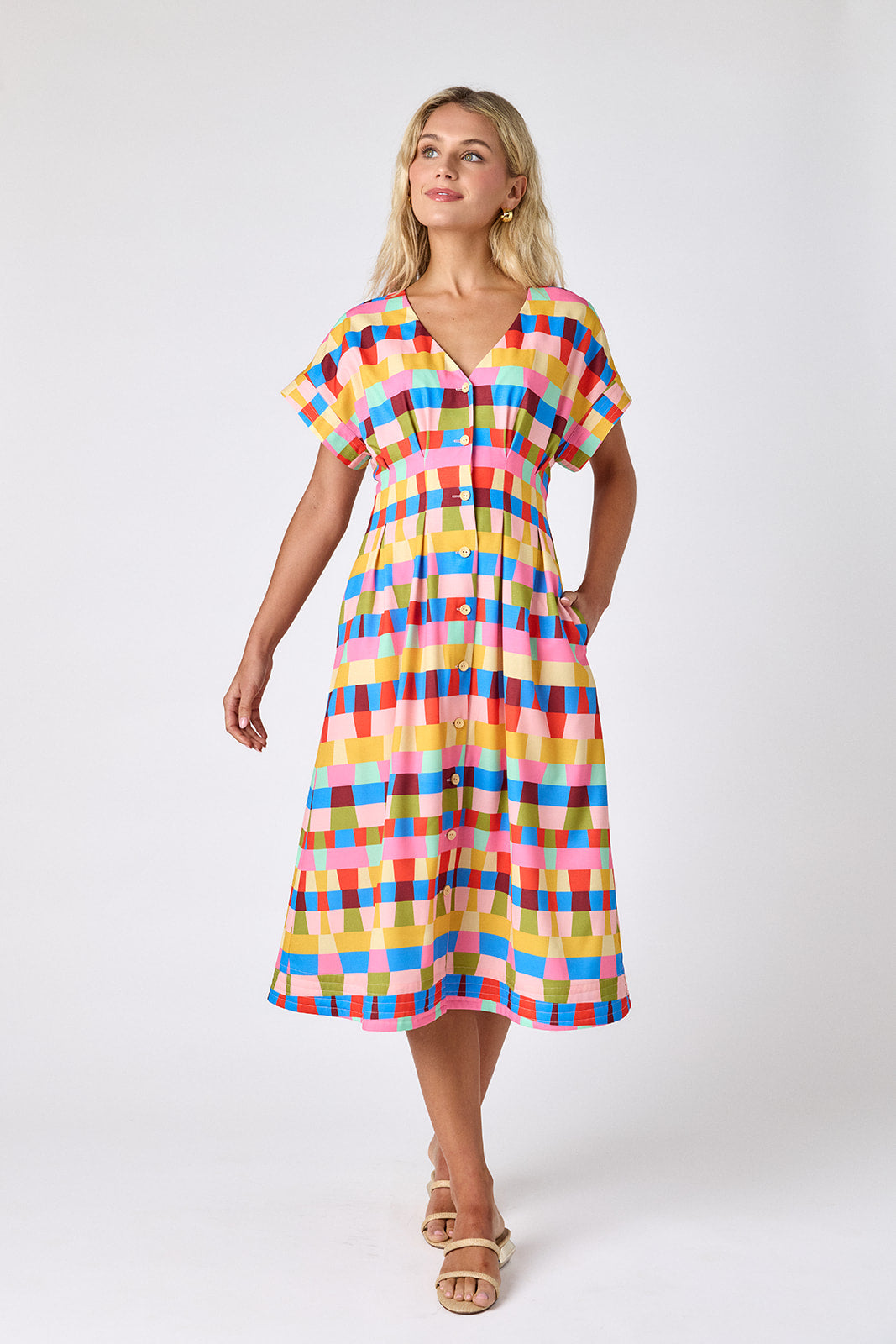 Prism short sleeved button-front midi dress with waist emphasis on model — CROSBY by Mollie Burch