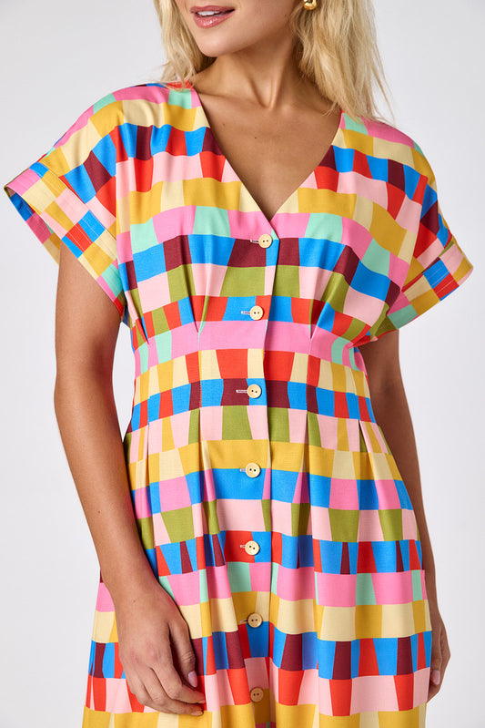 Prism short sleeved button-front midi dress with waist emphasis on model — CROSBY by Mollie Burch