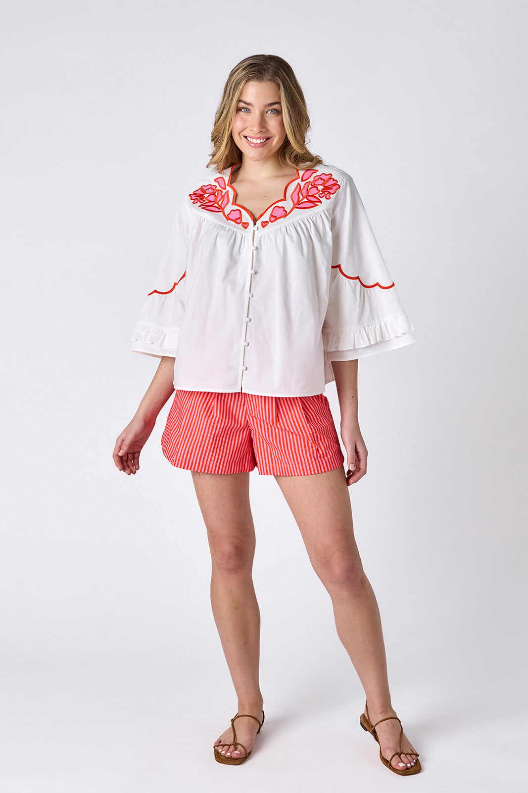 Rosy Ribbon tailored shorts with belt on model — CROSBY by Mollie Burch