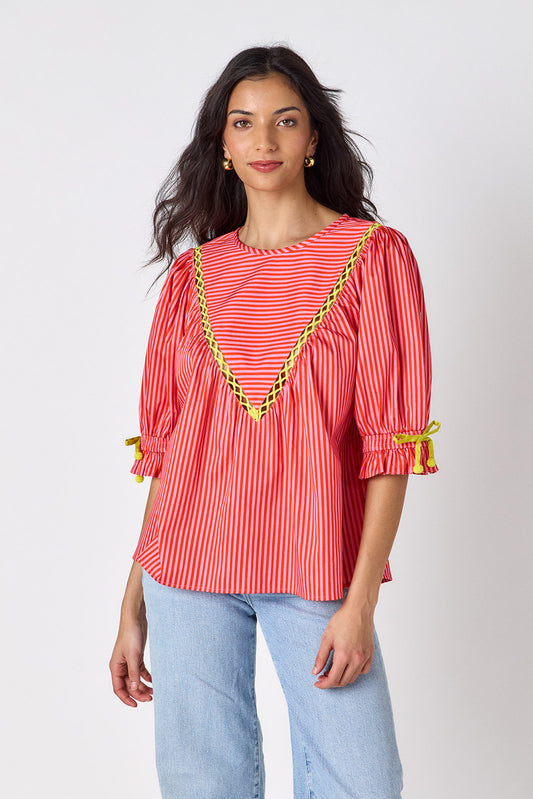 Rosy Ribbon puff sleeve top with tie detail on model — CROSBY by Mollie Burch
