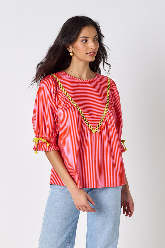 Orchid puff sleeve top with tie detail on model — CROSBY by Mollie Burch