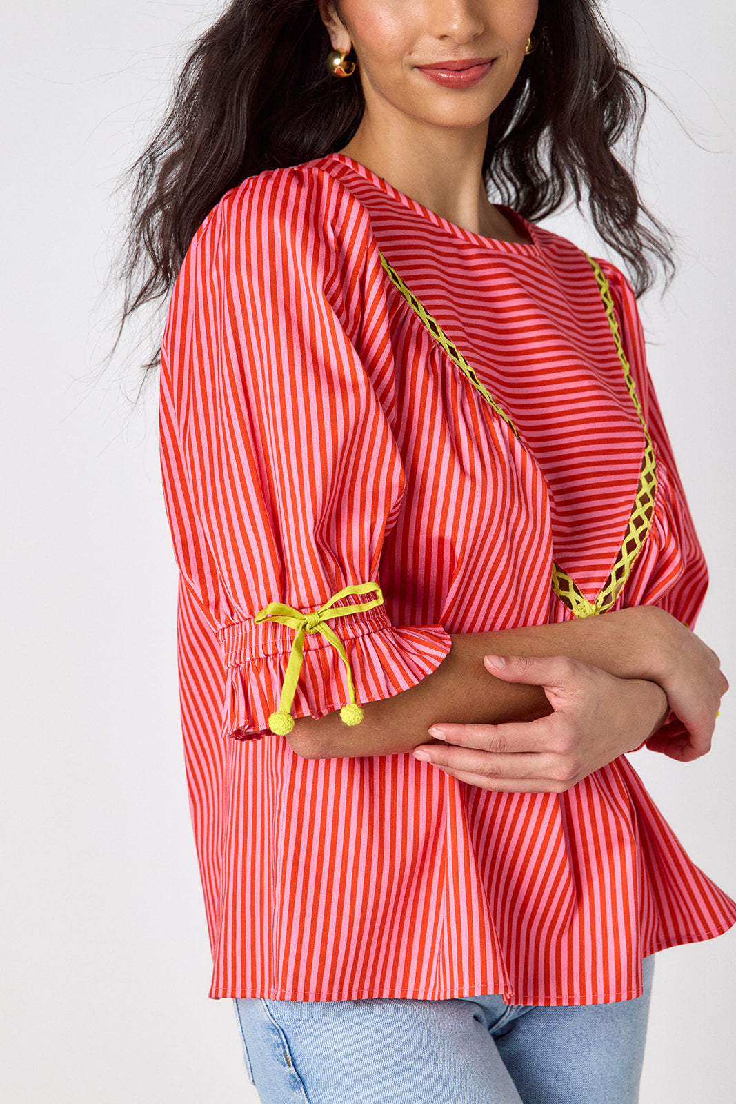 Orchid puff sleeve top with tie detail on model — CROSBY by Mollie Burch