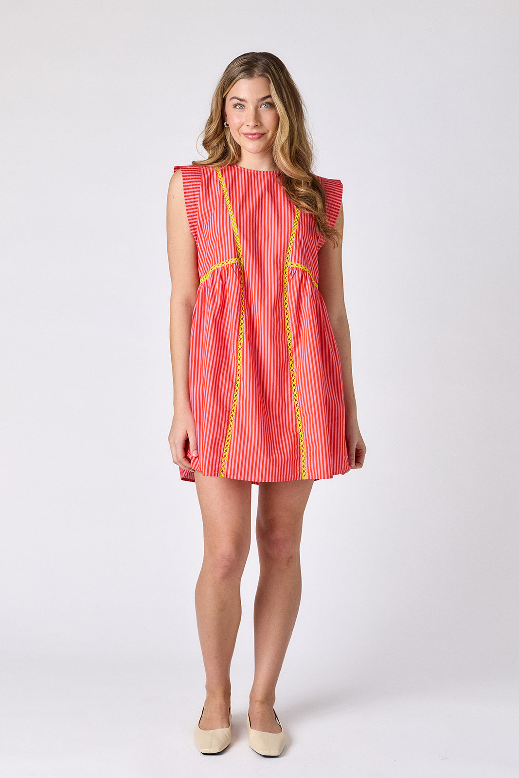 Rosy Ribbon mini dress with contrast fagoting detail on model — CROSBY by Mollie Burch