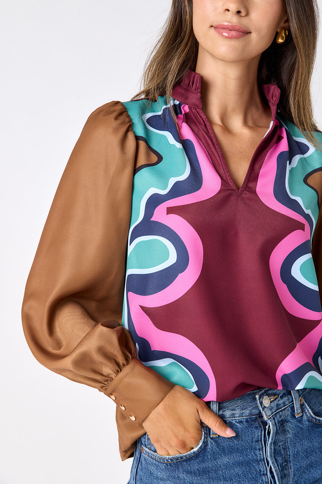 Serpentine relaxed fit long-sleeve blouse with ruffle standing collar on model – CROSBY by Mollie Burch