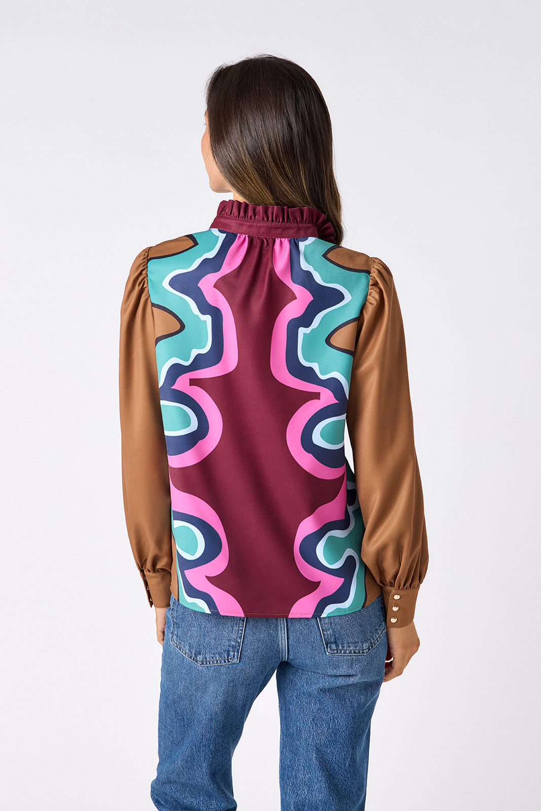 Serpentine relaxed fit long-sleeve blouse with ruffle standing collar on model – CROSBY by Mollie Burch