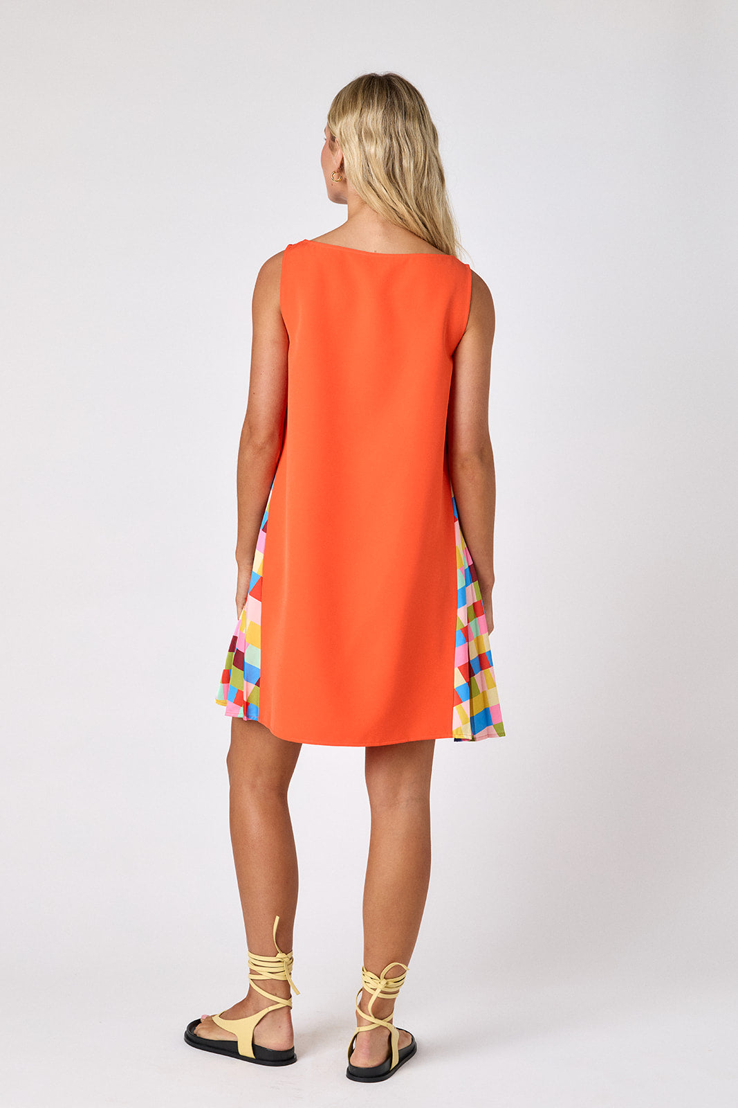 Prism tent style mini dress with side pleat detail on model — CROSBY by Mollie Burch