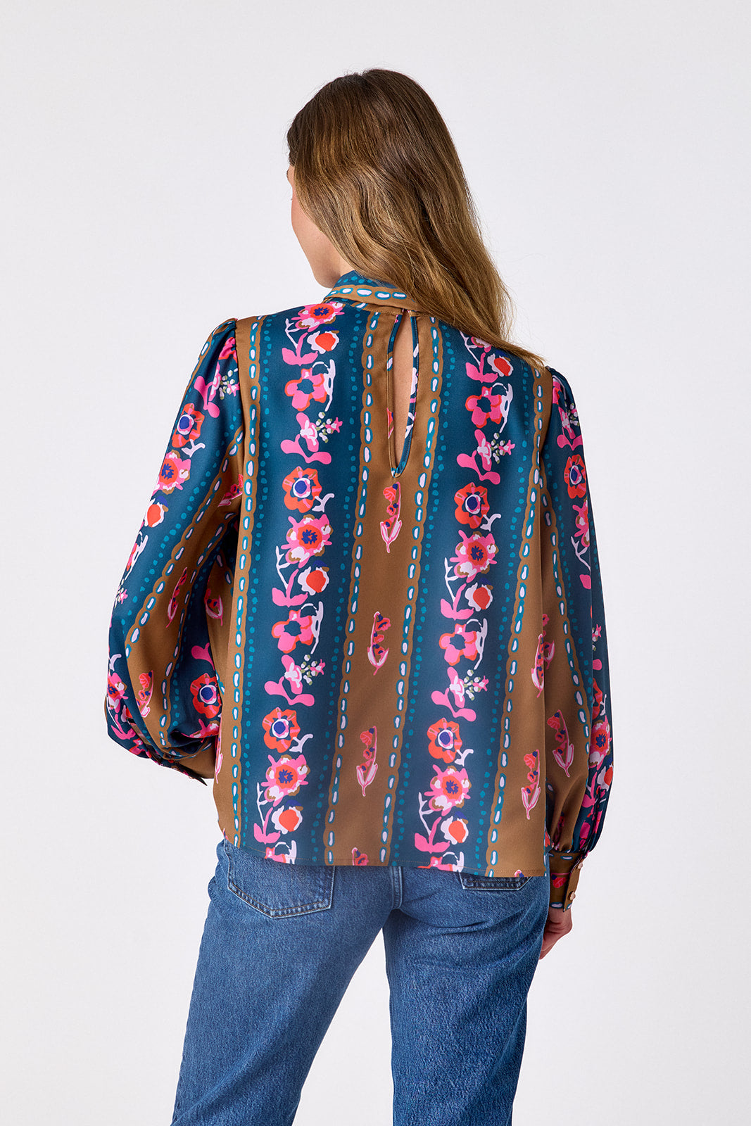 Tapestry Stripe flowy long-sleeve top with tie neck detail on model – CROSBY by Mollie Burch