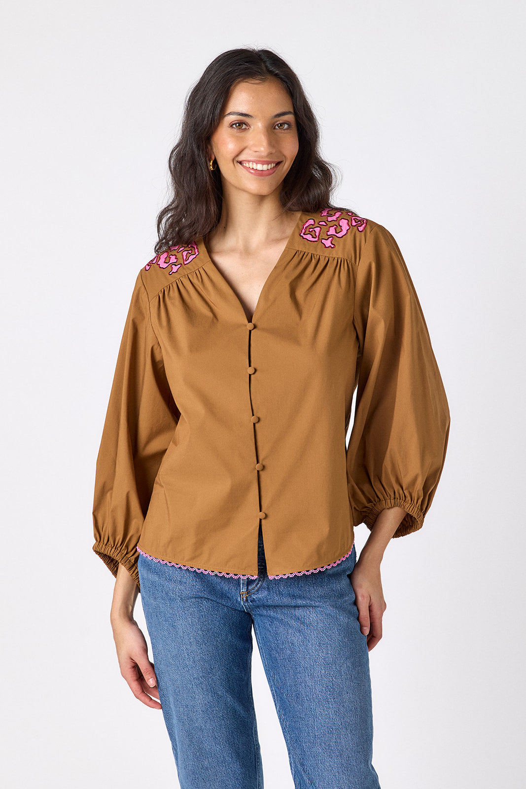 Teak button-front v-neck blouse with voluminous sleeve on model – CROSBY by Mollie Burch