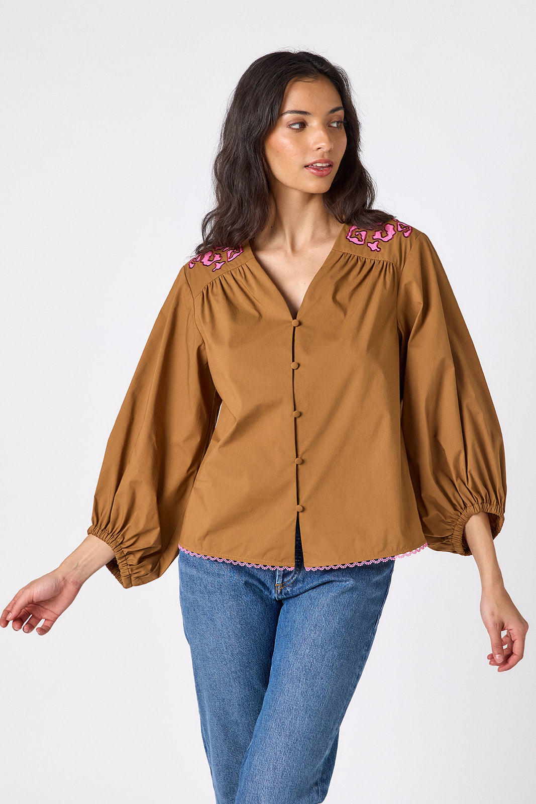Teak button-front v-neck blouse with voluminous sleeve on model – CROSBY by Mollie Burch