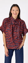 Lillian Top with short sleeves and versatile scarf detailing on model – CROSBY by Mollie Burch