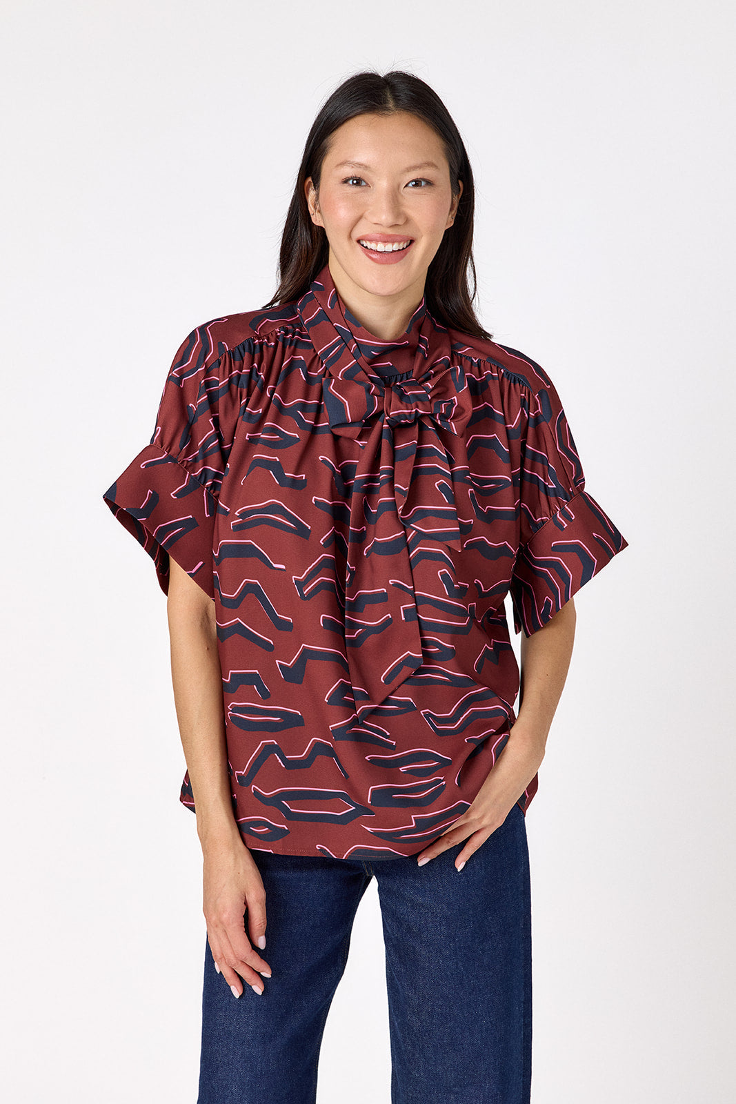 Lillian Top with short sleeves and versatile scarf detailing on model – CROSBY by Mollie Burch