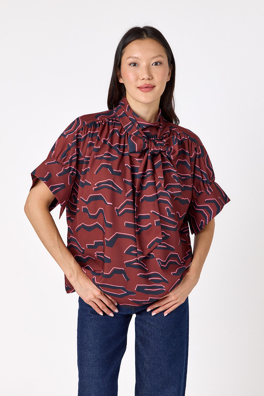 Lillian Top with short sleeves and versatile scarf detailing on model – CROSBY by Mollie Burch