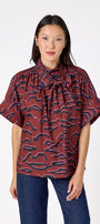Lillian Top with short sleeves and versatile scarf detailing on model – CROSBY by Mollie Burch