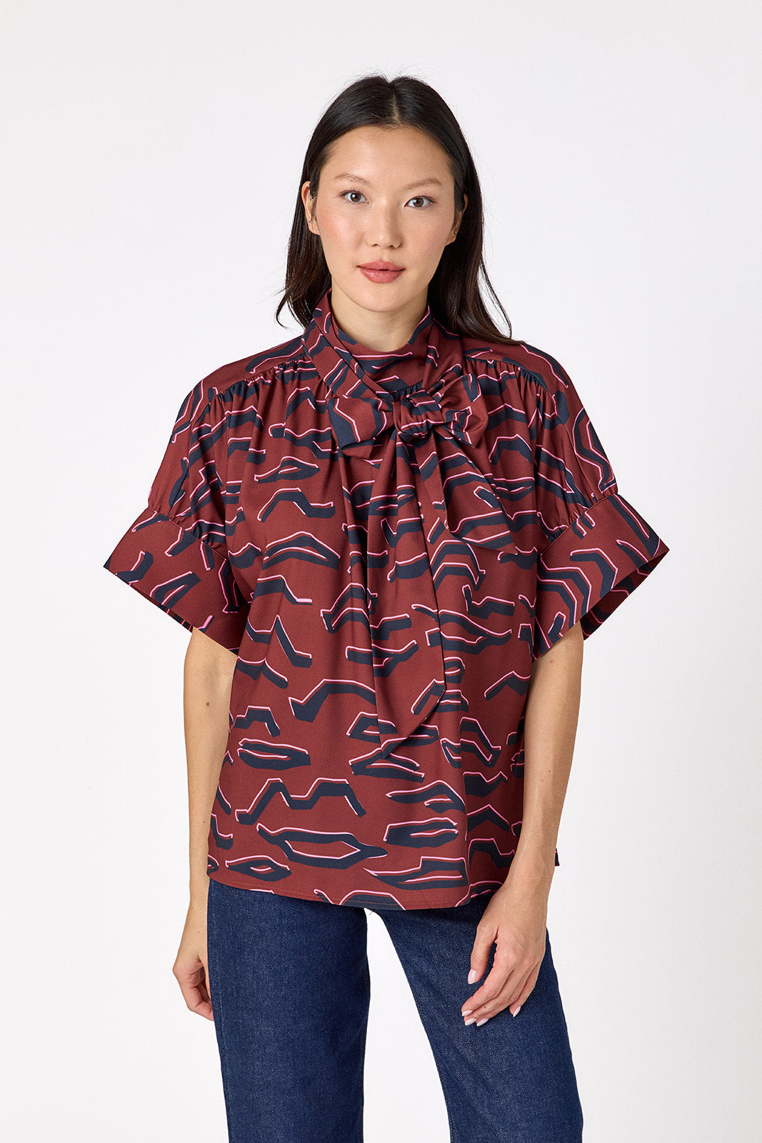 Lillian Top with short sleeves and versatile scarf detailing on model – CROSBY by Mollie Burch
