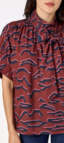 Lillian Top with short sleeves and versatile scarf detailing on model – CROSBY by Mollie Burch