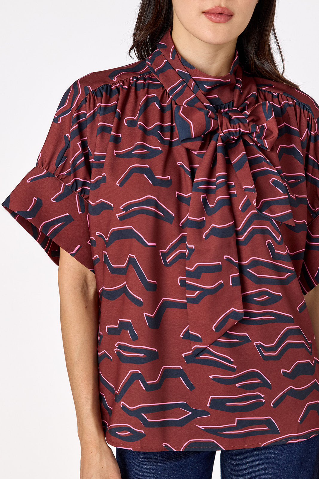 Lillian Top with short sleeves and versatile scarf detailing on model – CROSBY by Mollie Burch