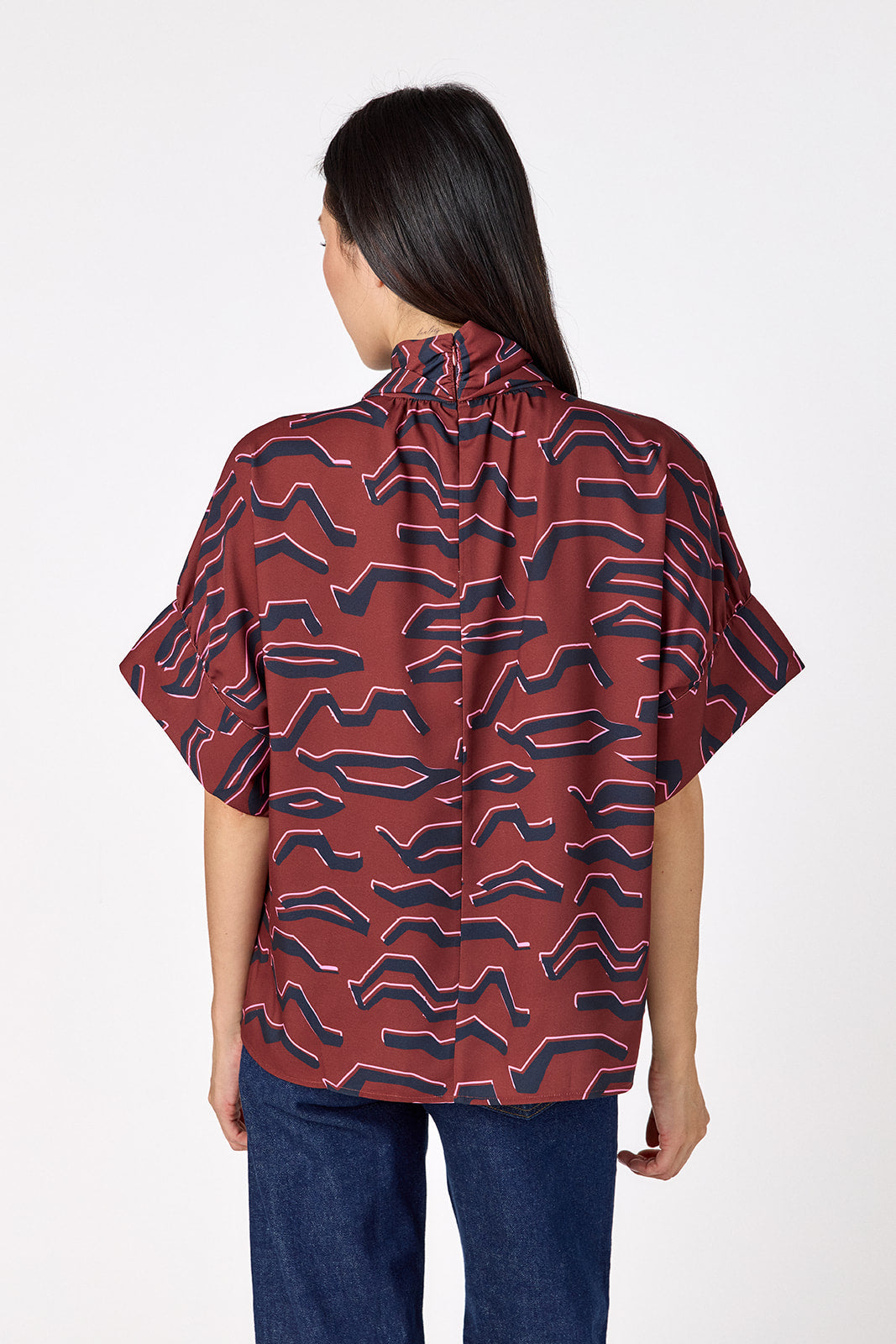Lillian Top with short sleeves and versatile scarf detailing on model – CROSBY by Mollie Burch