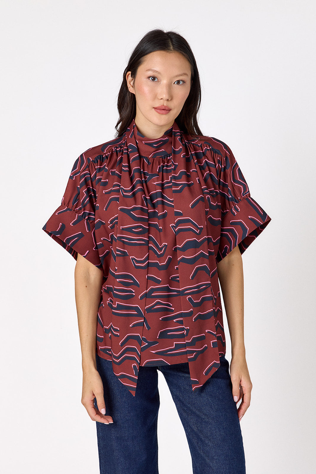 Lillian Top with short sleeves and versatile scarf detailing on model – CROSBY by Mollie Burch