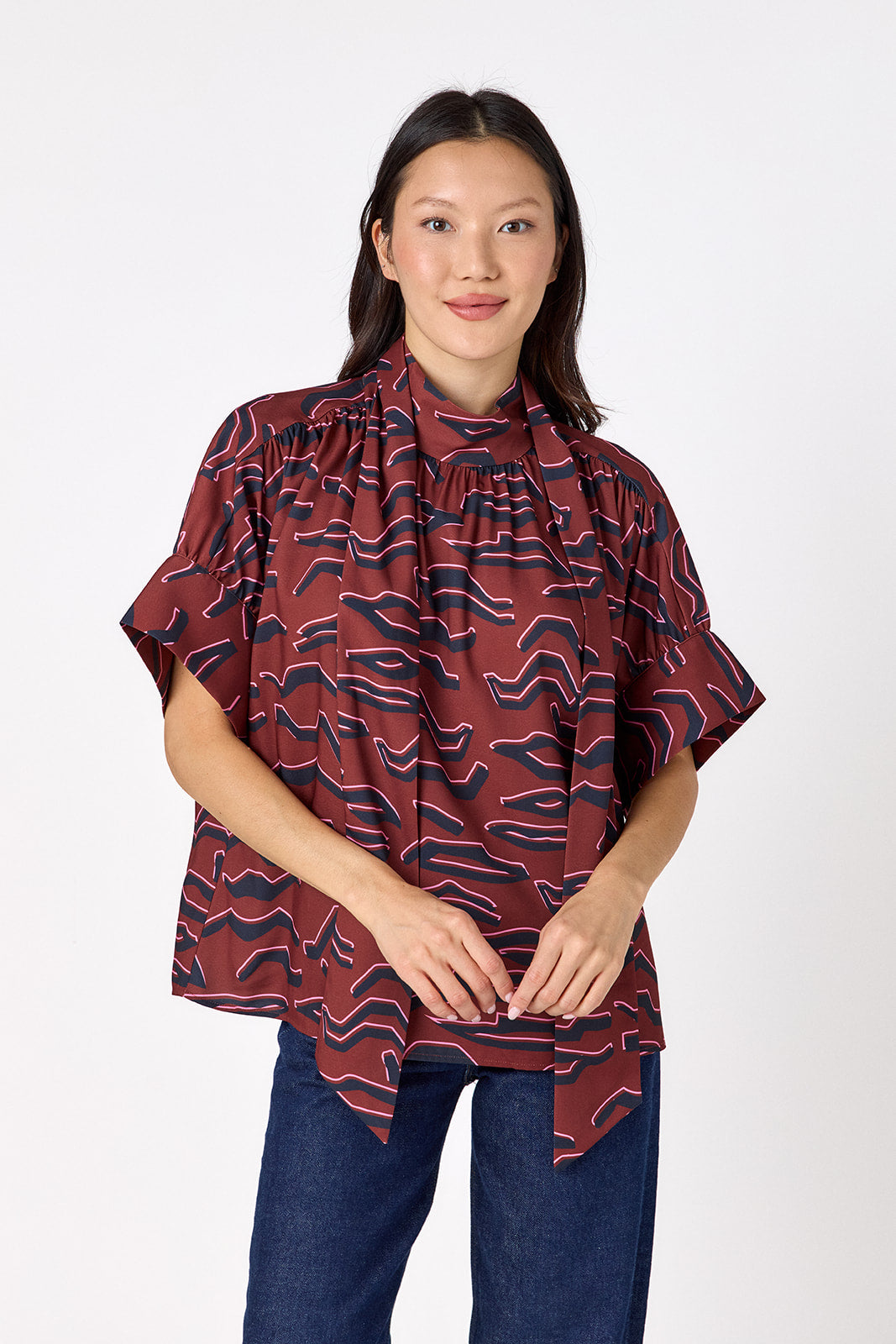 Lillian Top with short sleeves and versatile scarf detailing on model – CROSBY by Mollie Burch