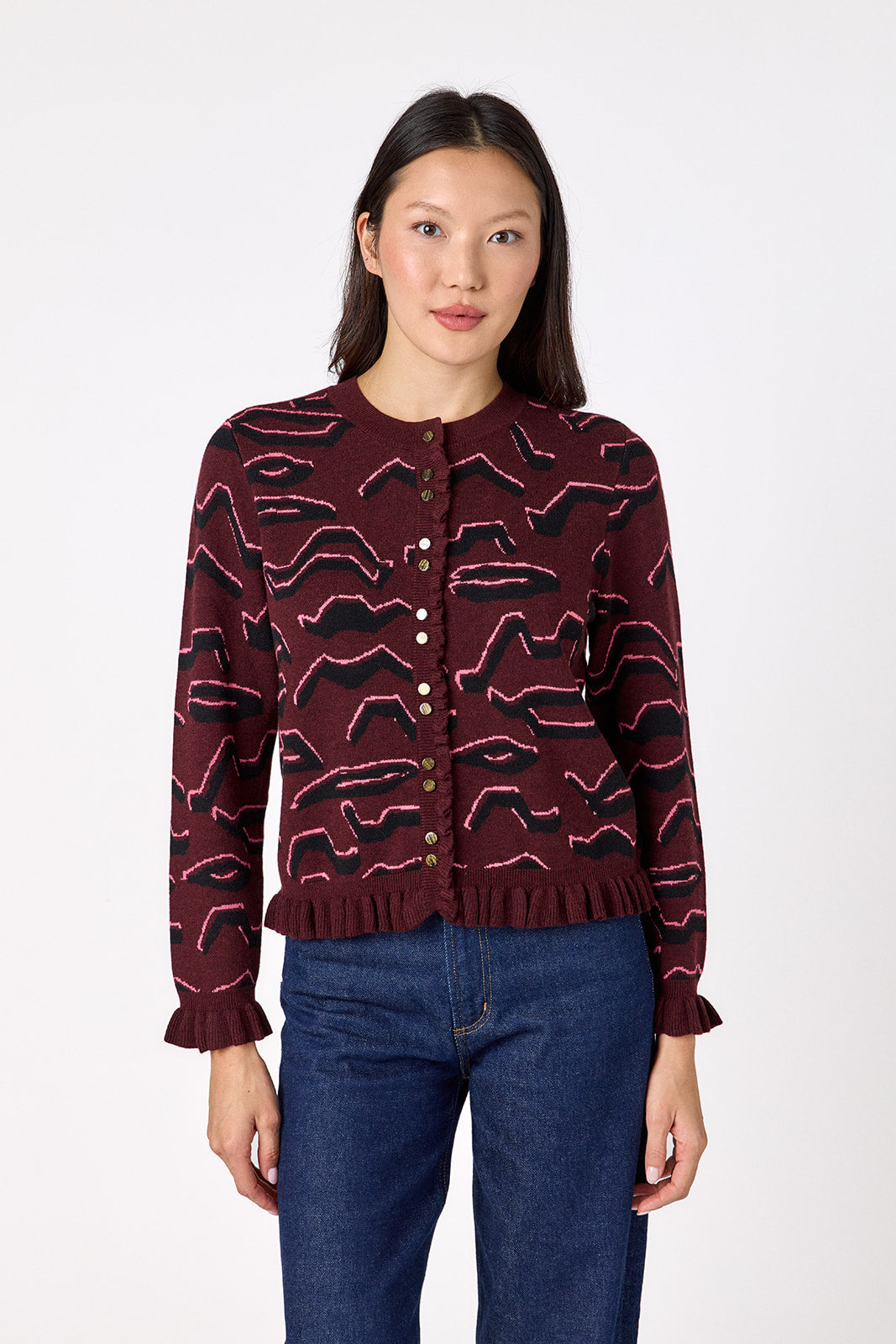 Sutton Cardigan in Tibetan Tiger featuring ruffle trim and front button detailing on model – CROSBY by Mollie Burch