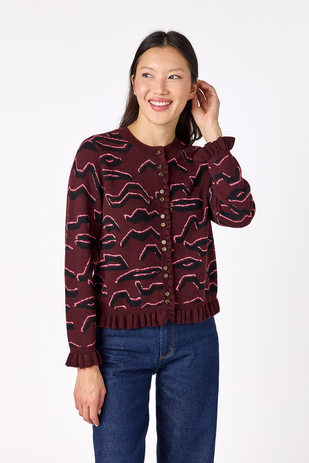 Sutton Cardigan in Tibetan Tiger featuring ruffle trim and front button detailing on model – CROSBY by Mollie Burch
