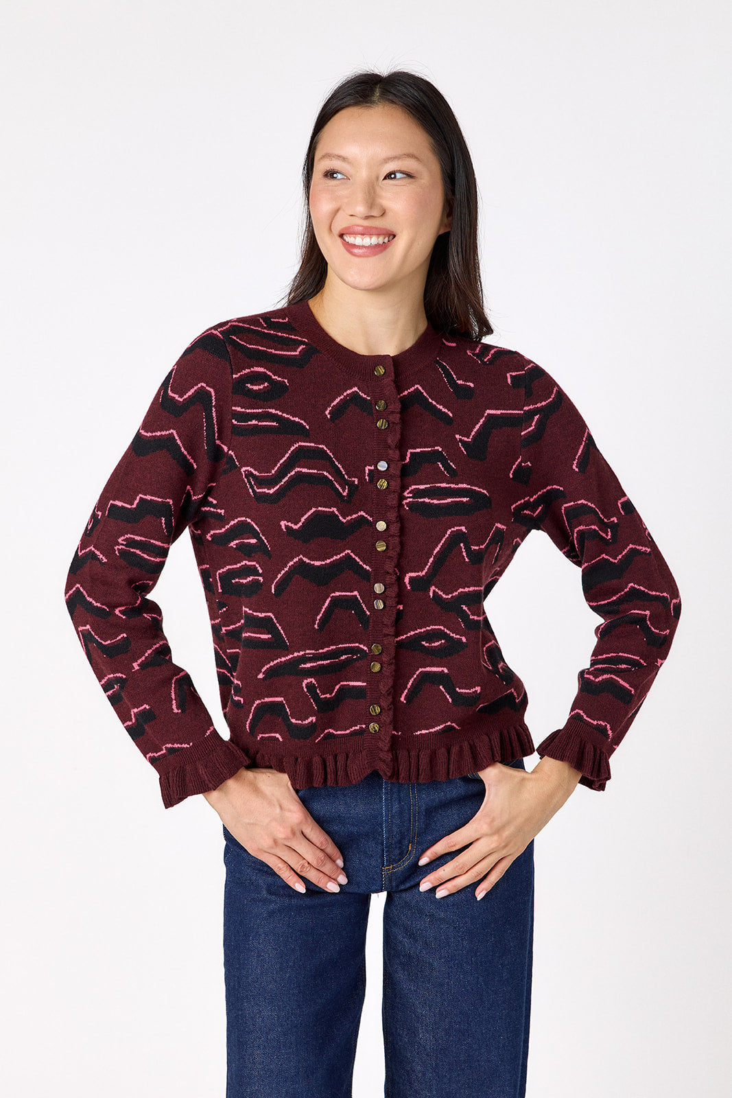 Sutton Cardigan in Tibetan Tiger featuring ruffle trim and front button detailing on model – CROSBY by Mollie Burch