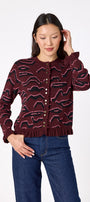 Sutton Cardigan in Tibetan Tiger featuring ruffle trim and front button detailing on model – CROSBY by Mollie Burch