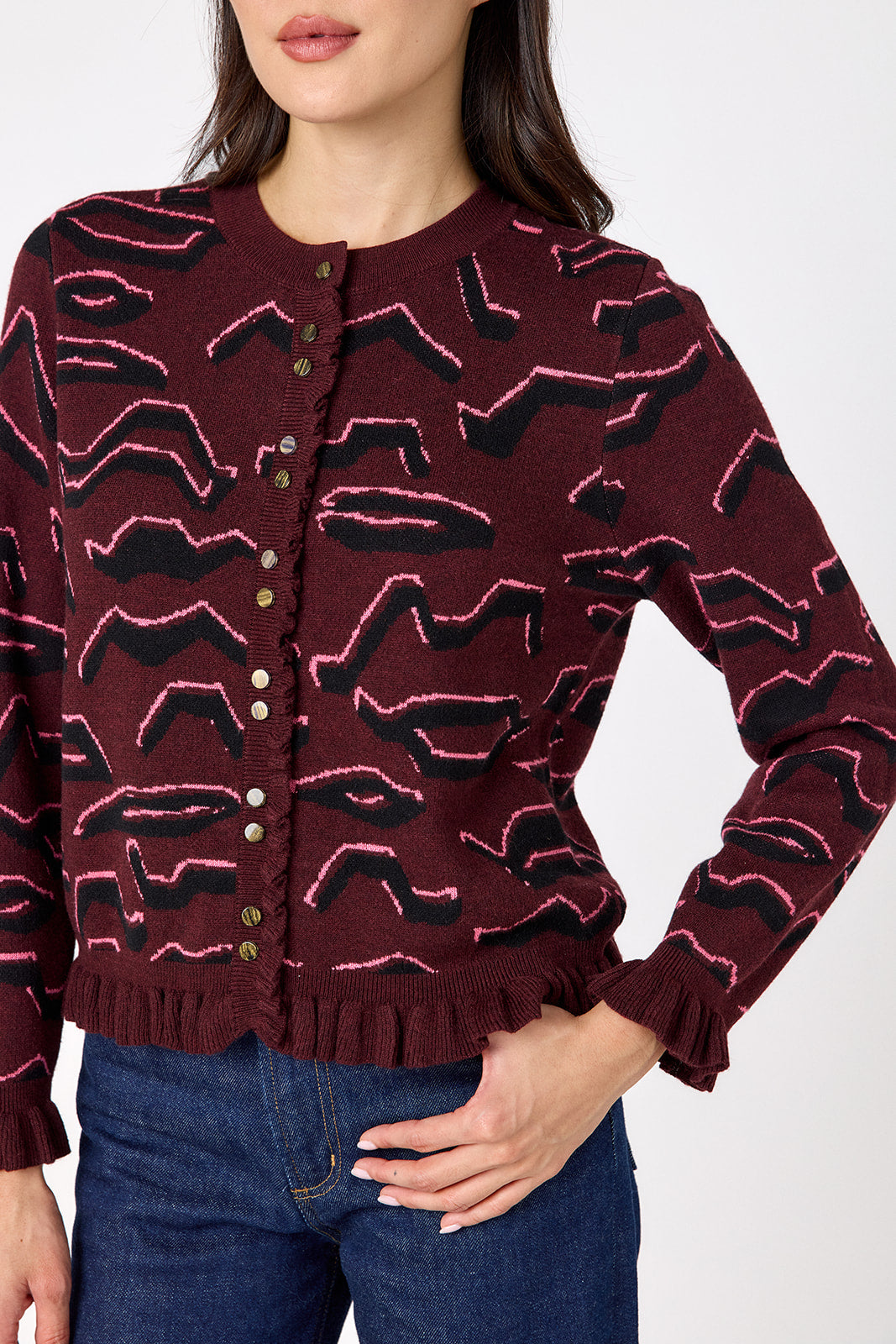 Sutton Cardigan in Tibetan Tiger featuring ruffle trim and front button detailing on model – CROSBY by Mollie Burch