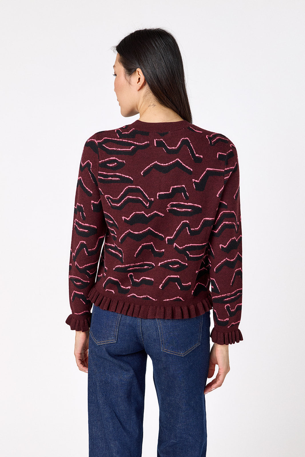 Sutton Cardigan in Tibetan Tiger featuring ruffle trim and front button detailing on model – CROSBY by Mollie Burch