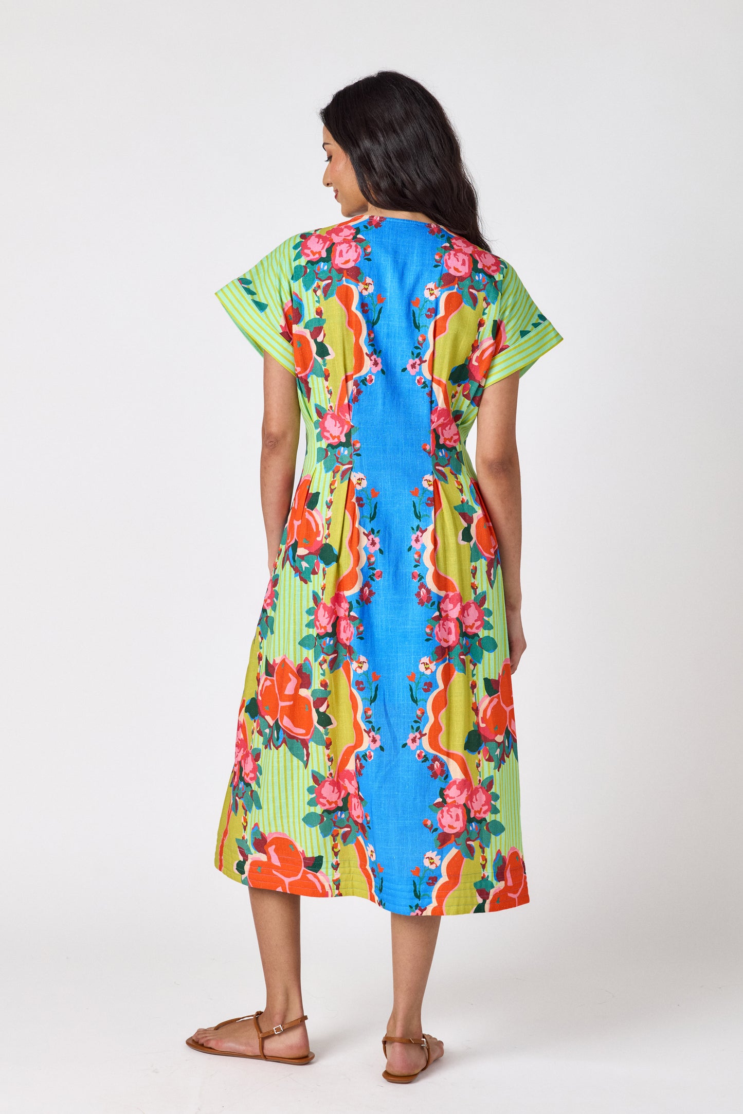 The Grove short sleeved button-front midi dress with waist emphasis on model — CROSBY by Mollie Burch