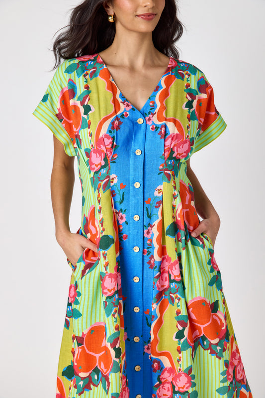 The Grove short sleeved button-front midi dress with waist emphasis on model — CROSBY by Mollie Burch