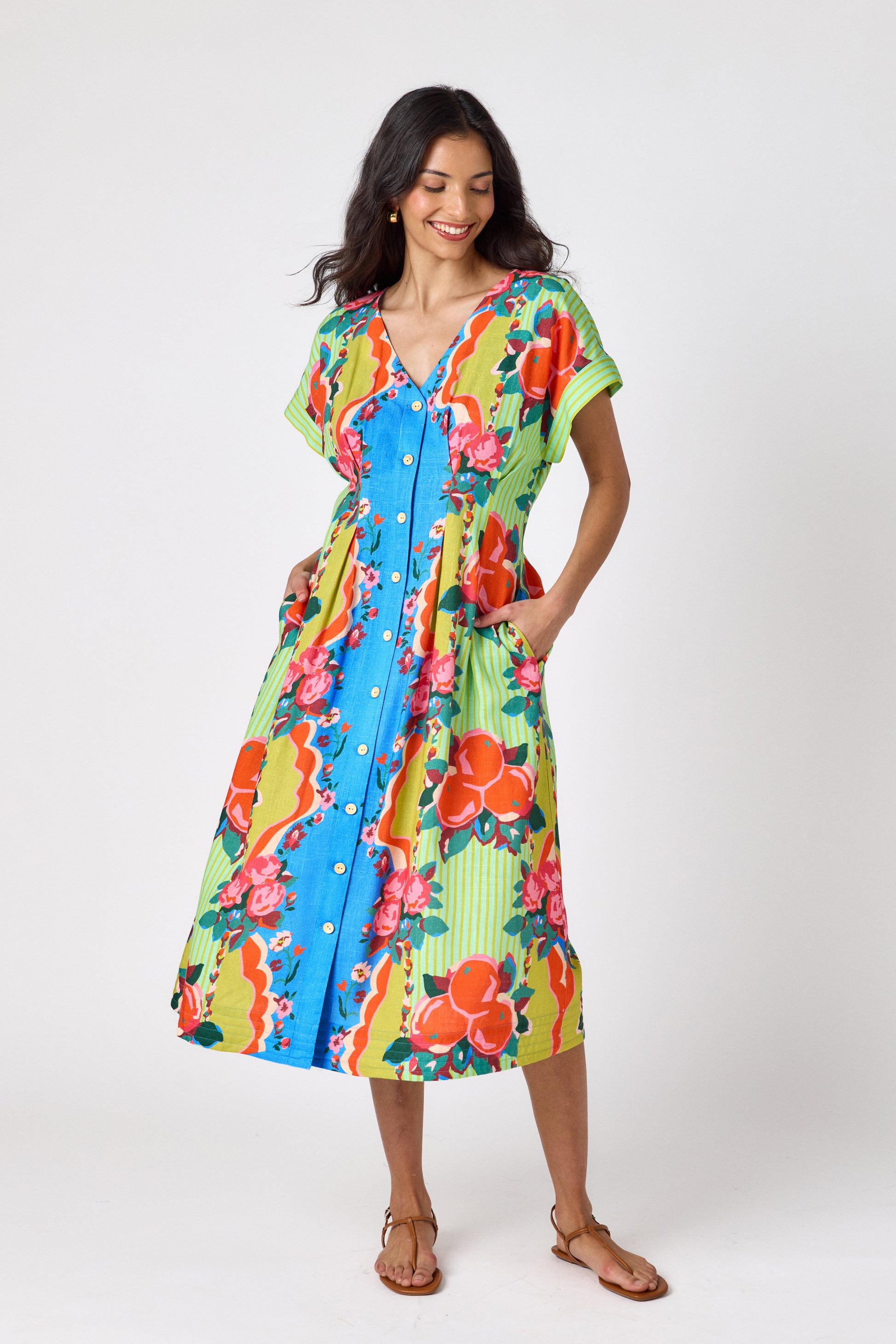 The Grove short sleeved button-front midi dress with waist emphasis on model — CROSBY by Mollie Burch