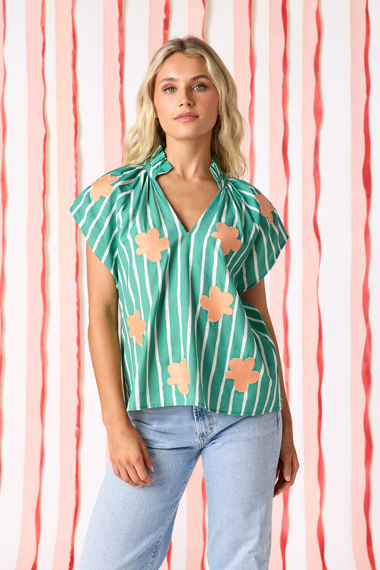 Veranda Stripe raglan style short sleeve top with embroidered flowers on model — CROSBY by Mollie Burch
