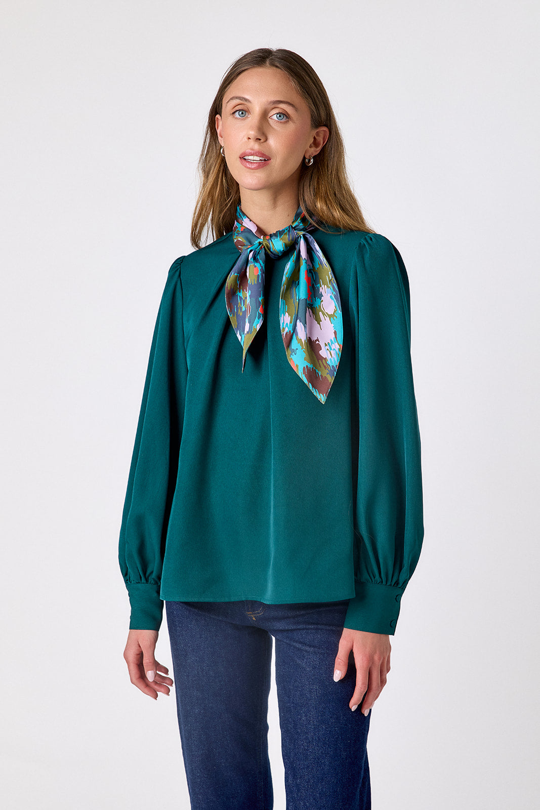  Verdigris flowy long-sleeve top with tie neck detail on model – CROSBY by Mollie Burch