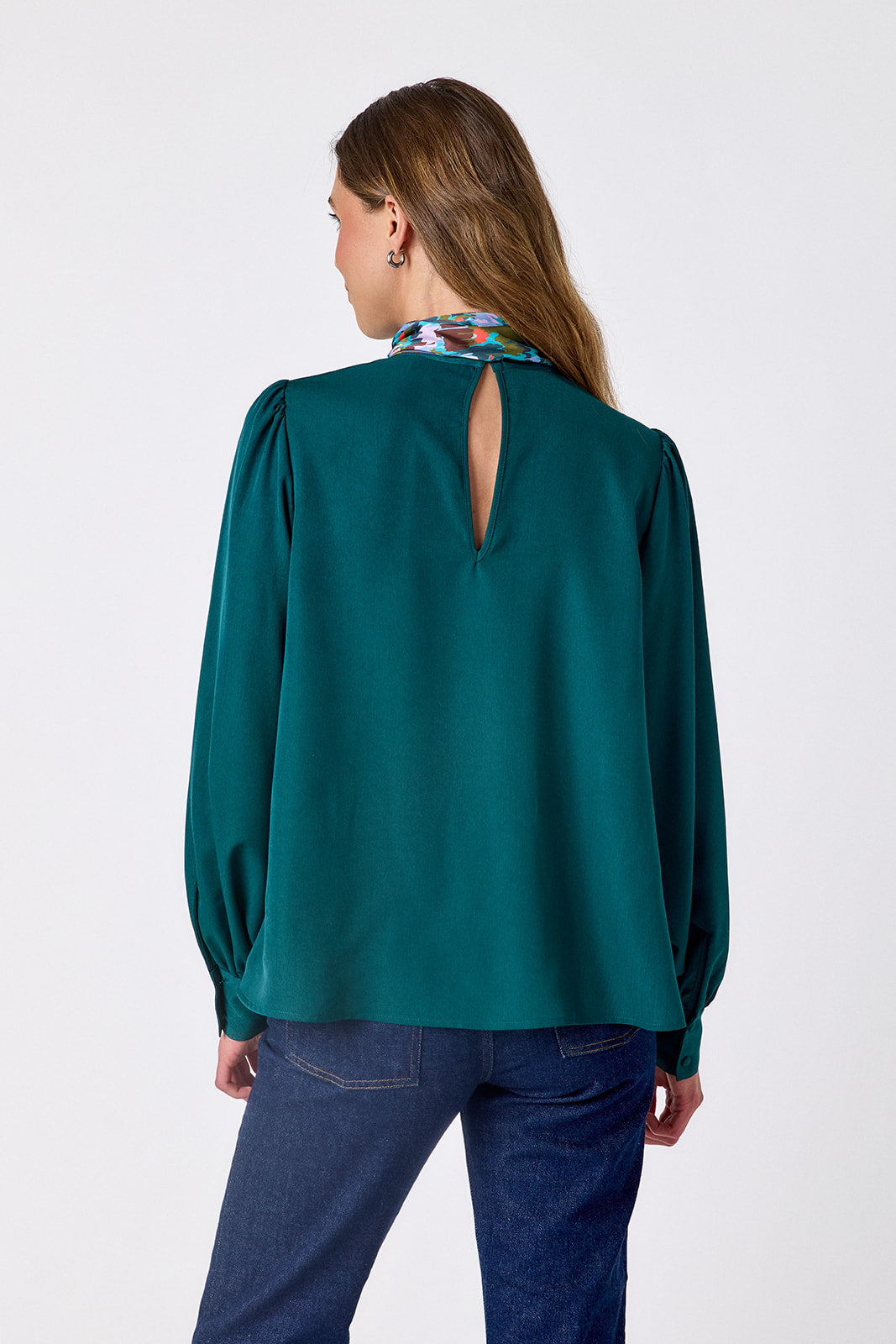  Verdigris flowy long-sleeve top with tie neck detail on model – CROSBY by Mollie Burch
