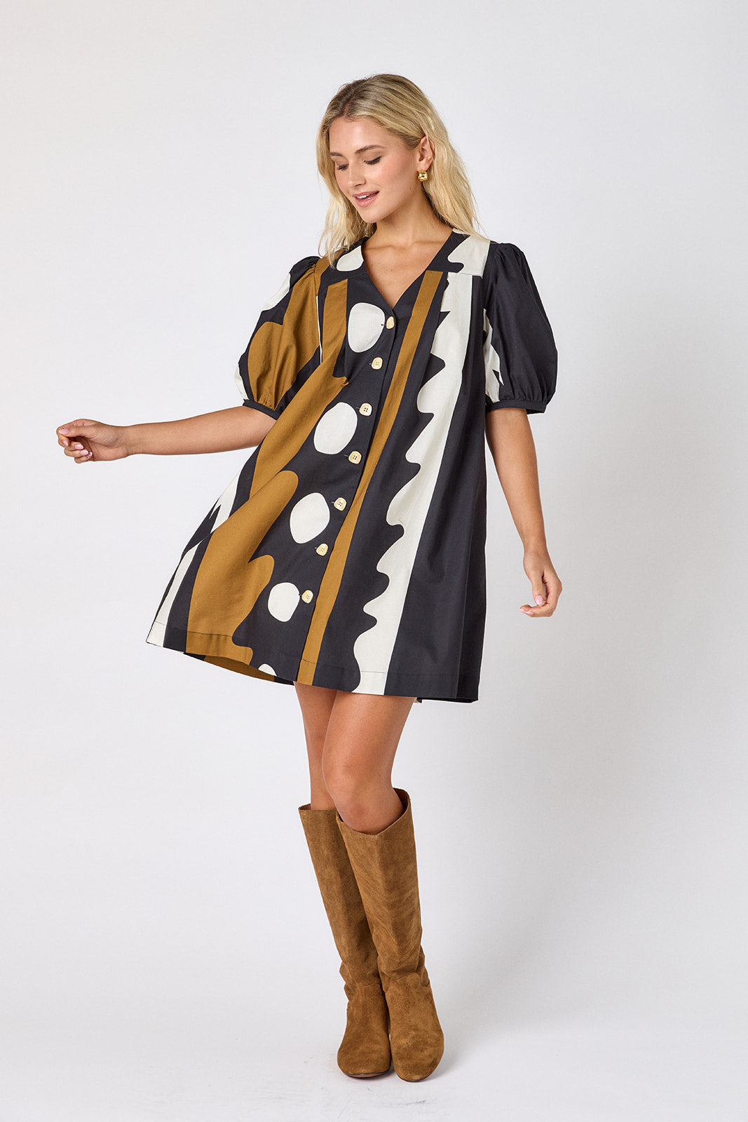 Wild Line v-neck dress with puff sleeves and a swingy silhouette on model — CROSBY by Mollie Burch