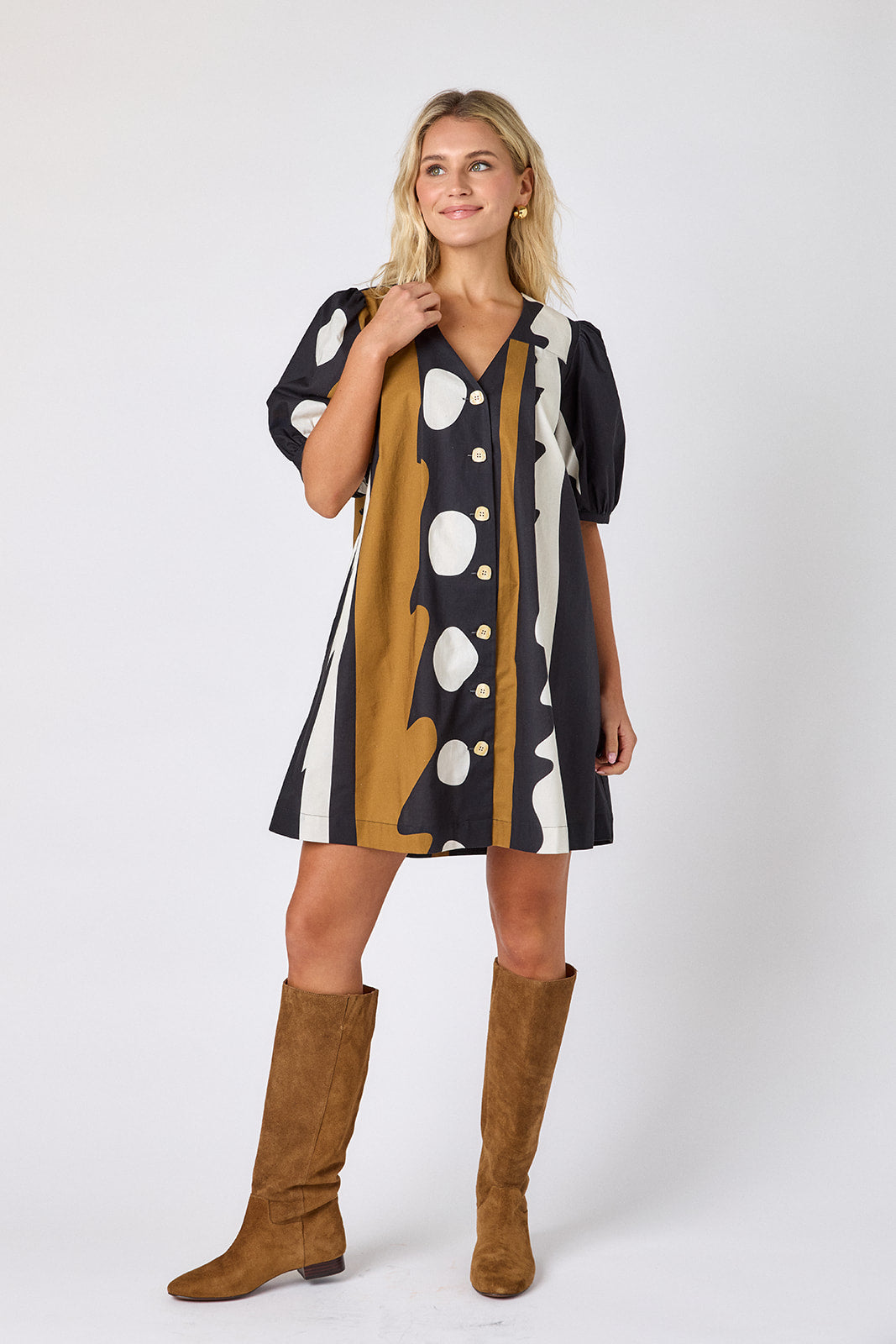 Wild Line v-neck dress with puff sleeves and a swingy silhouette on model — CROSBY by Mollie Burch