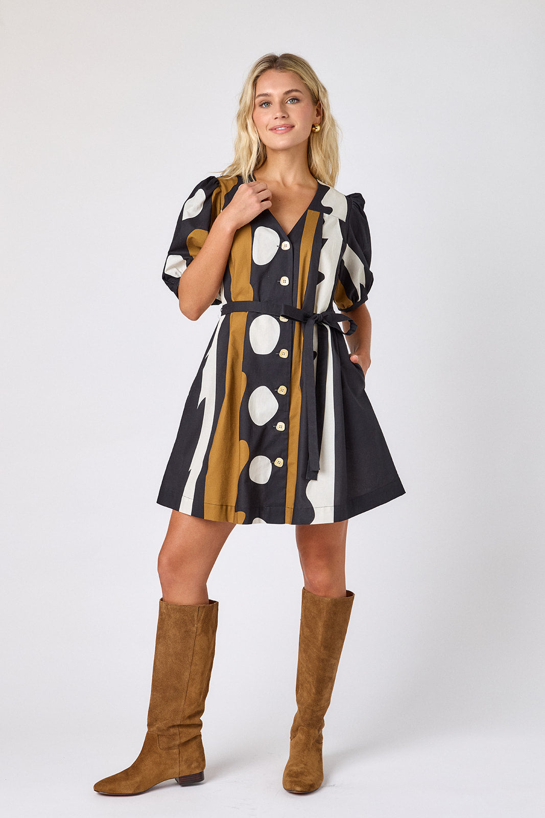 Wild Line v-neck dress with puff sleeves and a swingy silhouette on model — CROSBY by Mollie Burch