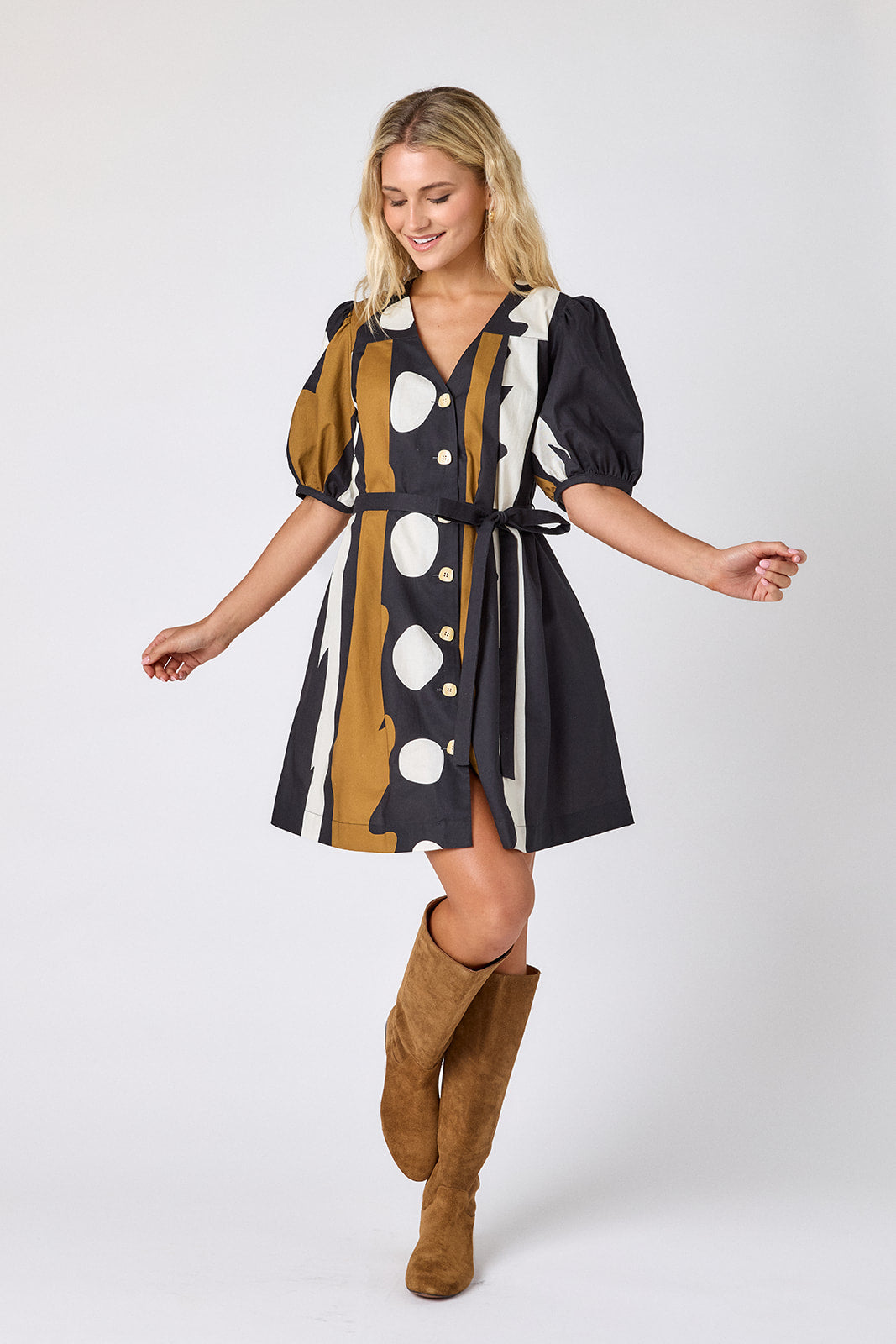 Wild Line v-neck dress with puff sleeves and a swingy silhouette on model — CROSBY by Mollie Burch