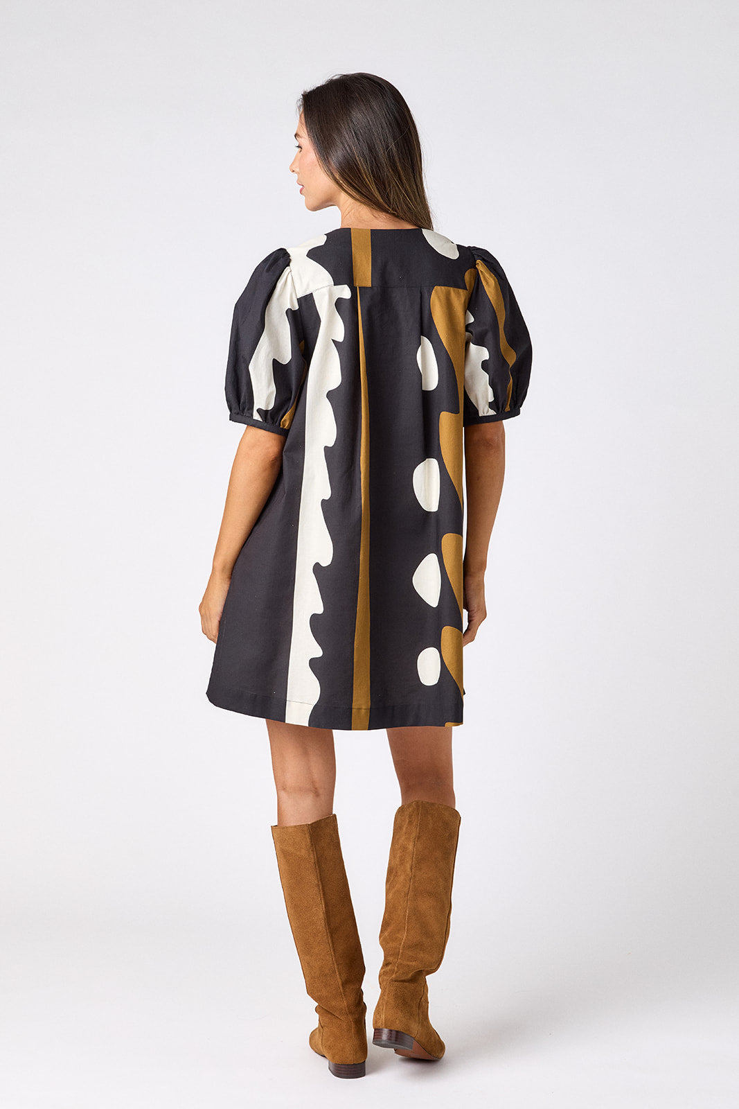 Wild Line v-neck dress with puff sleeves and a swingy silhouette on model — CROSBY by Mollie Burch