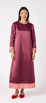 Drewry Dress in Wine featuring satin fabric and contrast fringe trim on model – CROSBY by Mollie Burch