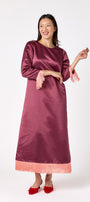 Drewry Dress in Wine featuring satin fabric and contrast fringe trim on model – CROSBY by Mollie Burch