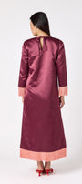 Drewry Dress in Wine featuring satin fabric and contrast fringe trim on model – CROSBY by Mollie Burch