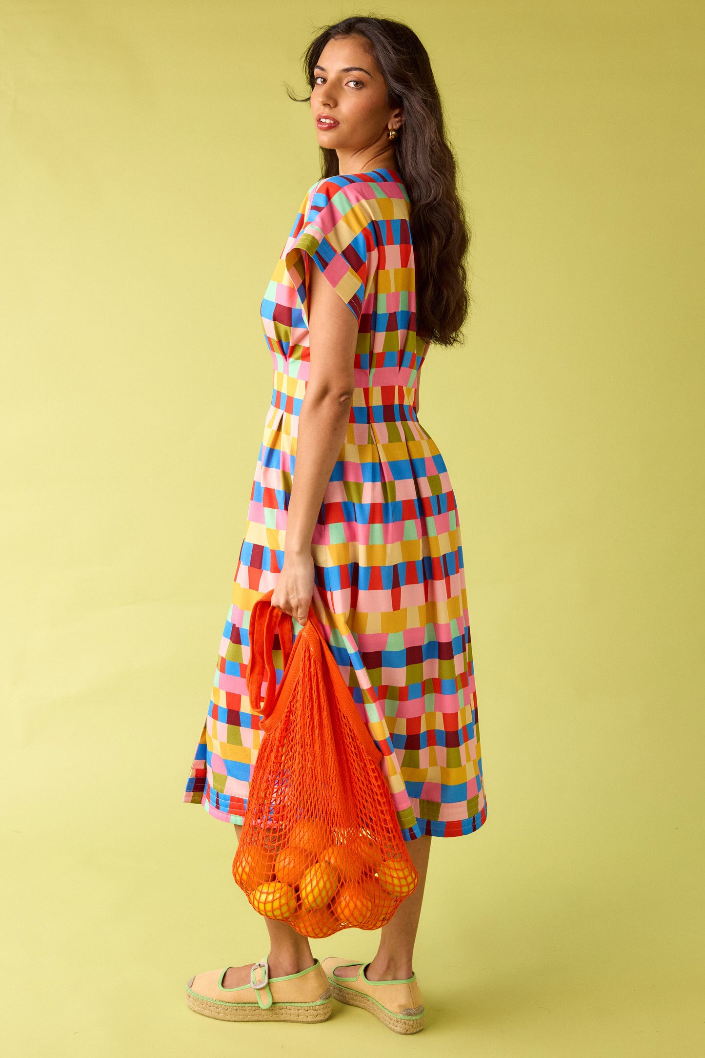 Prism short sleeved button-front midi dress with waist emphasis on model — CROSBY by Mollie Burch