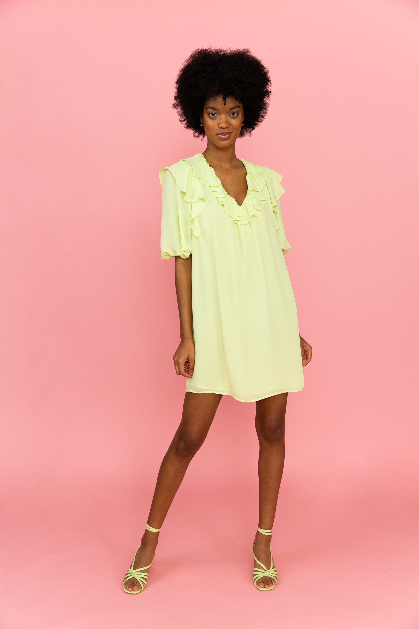 Sherbert yellow mini dress with puff sleeve and ruffles at the neckline